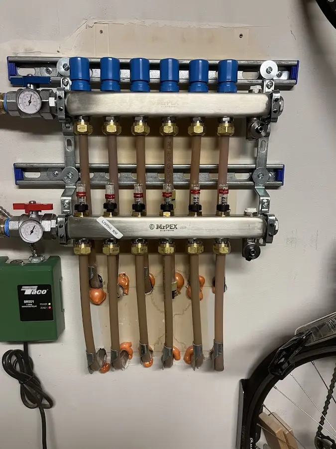 Plumber performing Water Heater Repair at a residential property in Escanaba